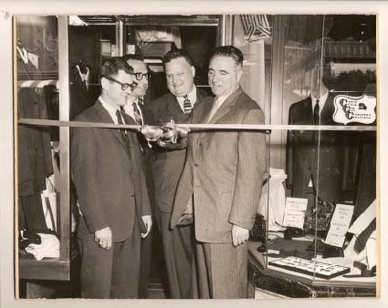 Ribbon cutting at a Cable Car Clothiers opening, from the store archive